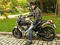 man posing on a motorcycle