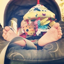 baby feet in a baby stroller