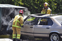 fire fighters workink at a car accident scene
