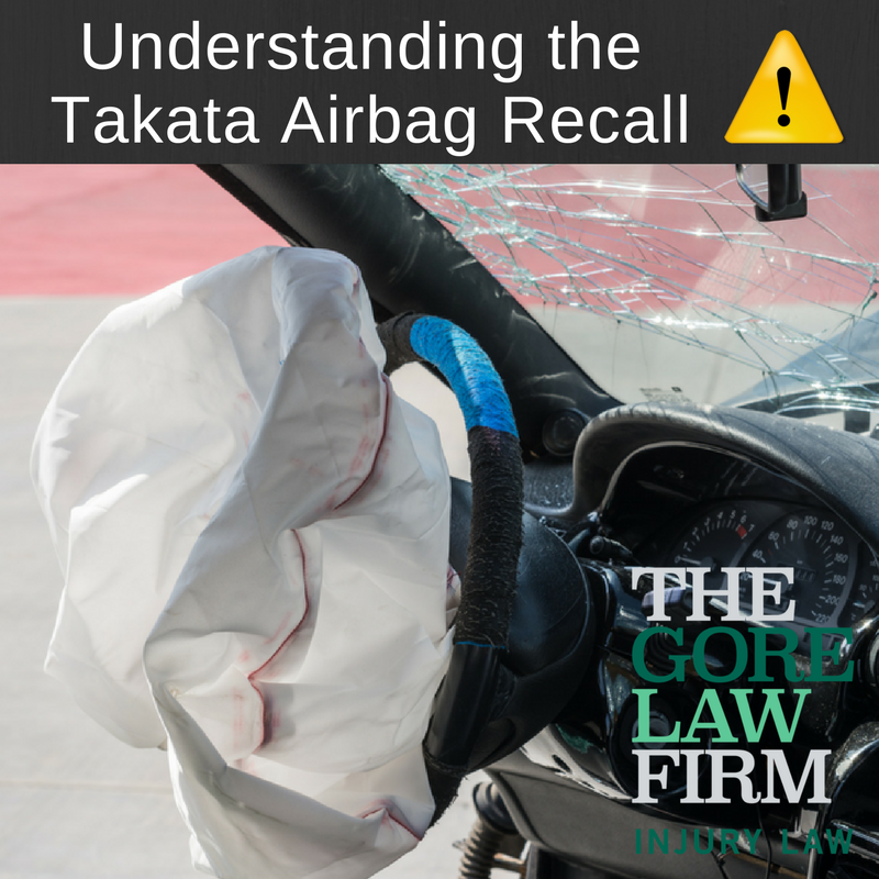 posyter with an airbag and sign that says "Understanding the takata airbag recall"