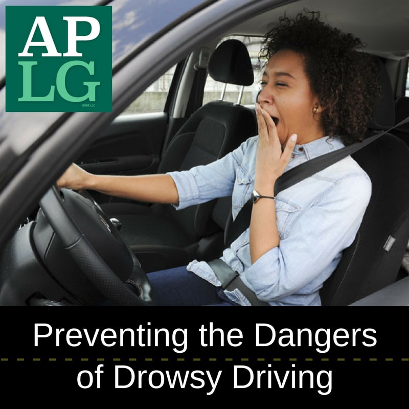 woman yawning while driving and a sign that says "Preventing the dangerous of dowsy driving"