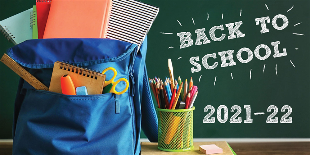 A backpack and school supplies near a chalkboard with information about going back to school.