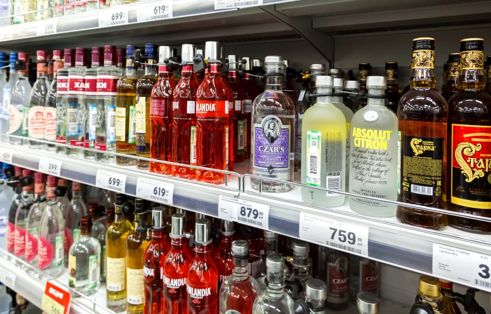 Display of alcoholic beverages in hypermarket, offering a diverse selection for customers.